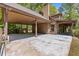 Attached carport of a log home showing ample parking space and exterior features at 2377 Pine Mountain Rd, Kennesaw, GA 30152