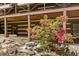 Rustic log home with blooming azaleas, complemented by wooden trim and stonework at 2377 Pine Mountain Rd, Kennesaw, GA 30152