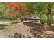 Beautiful log cabin-style home with a convenient carport and well-maintained yard in a wooded setting at 2377 Pine Mountain Rd, Kennesaw, GA 30152