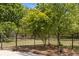 Secure gated yard with meticulously maintained landscaping, ensuring privacy and curb appeal at 2377 Pine Mountain Rd, Kennesaw, GA 30152