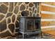 Elegant fireplace with stone and wooden accents creating a cozy and inviting ambiance at 2377 Pine Mountain Rd, Kennesaw, GA 30152