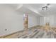 View of the living room showcasing tile flooring, lighting, and doorways to the bathroom and kitchen at 2377 Pine Mountain Rd, Kennesaw, GA 30152