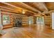 Spacious living room with wood floors, a stone fireplace, and natural light at 2377 Pine Mountain Rd, Kennesaw, GA 30152