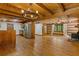Expansive living room featuring a modern kitchen, cozy fireplace, staircase, and bright windows at 2377 Pine Mountain Rd, Kennesaw, GA 30152