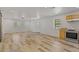 Spacious living room filled with natural light, featuring modern wood-look floors and neutral paint at 2377 Pine Mountain Rd, Kennesaw, GA 30152
