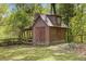Charming outbuilding with barn doors and a rustic aesthetic, perfect for a workshop or storage at 2377 Pine Mountain Rd, Kennesaw, GA 30152