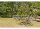 Picturesque yard with a classic wooden fence, complemented by mature trees and established landscaping at 2377 Pine Mountain Rd, Kennesaw, GA 30152