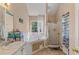 Bathroom featuring a corner soaking tub, sink, vanity, and a standalone shower at 240 Creekview Blvd, Covington, GA 30016