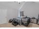 Bedroom with light gray walls, a bed, baby crib, and dark gray storage at 240 Creekview Blvd, Covington, GA 30016