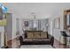 Inviting living room with a comfortable sofa, a dining area, and an adjacent view into the kitchen at 240 Creekview Blvd, Covington, GA 30016