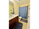 Bathroom featuring a wooden vanity with a shower and bath curtain at 6156 Thorncrest Dr, Tucker, GA 30084