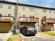 Townhome exterior showing balconies and attached garage at 6156 Thorncrest Dr, Tucker, GA 30084