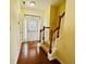 Foyer area featuring hardwood floors, natural light, and an adjacent staircase at 6156 Thorncrest Dr, Tucker, GA 30084