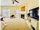 Cozy living room with a fireplace, large windows, and a sliding door to the outside at 6156 Thorncrest Dr, Tucker, GA 30084