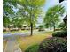Charming street view showcasing landscaped front yards and mature trees at 6156 Thorncrest Dr, Tucker, GA 30084