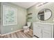 Freshly painted bathroom with wood-look floors, and modern fixtures at 831 Terrace Trce, Lawrenceville, GA 30044