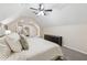 Spacious bedroom featuring an arched entryway, neutral walls, and a large, comfortable bed at 831 Terrace Trce, Lawrenceville, GA 30044