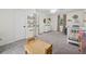 Spacious carpeted bedroom with a crib, a ceiling fan and a double door closet at 831 Terrace Trce, Lawrenceville, GA 30044