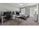 Cozy bedroom featuring neutral walls, plush gray carpet, a ceiling fan, and a well-organized workspace at 831 Terrace Trce, Lawrenceville, GA 30044