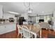 Eat-in kitchen featuring white cabinets, granite countertops and wood flooring at 831 Terrace Trce, Lawrenceville, GA 30044