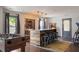 Entertaining game room features a wet bar, foosball table, and ample seating, perfect for hosting friends at 10559 Serenbe Ln, Chattahoochee Hills, GA 30268