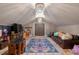 Spacious playroom with plenty of room to play, featuring unique lighting fixtures and lots of natural light at 10559 Serenbe Ln, Chattahoochee Hills, GA 30268