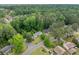 Neighborhood aerial view showcasing the lush tree coverage and well-maintained homes at 1448 Drayton Woods Dr, Tucker, GA 30084