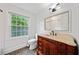 Bathroom showcasing a vanity, tiled floor, and a window for natural light at 1448 Drayton Woods Dr, Tucker, GA 30084