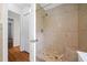 Clean and updated bathroom featuring shower and built-in seat; neutral wall tile at 1448 Drayton Woods Dr, Tucker, GA 30084