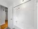 Tiled bathroom featuring a bathtub with shower and a white tile surround at 1448 Drayton Woods Dr, Tucker, GA 30084