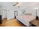 Sunny bedroom with hardwood floors, closet, and ceiling fan at 1448 Drayton Woods Dr, Tucker, GA 30084