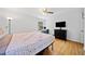 Spacious bedroom features hardwood floors, neutral tones, and a large window at 1448 Drayton Woods Dr, Tucker, GA 30084