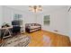 Bedroom featuring a daybed, hardwood floors, and a ceiling fan at 1448 Drayton Woods Dr, Tucker, GA 30084