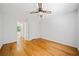 This bright and spacious bedroom offers hardwood floors and a modern ceiling fan at 1448 Drayton Woods Dr, Tucker, GA 30084