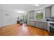 Bright kitchen area with stainless steel appliances, stylish cabinets, and hardwood floors at 1448 Drayton Woods Dr, Tucker, GA 30084