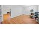 Living room area with hardwood floors, a partial view into the kitchen and nice decor at 1448 Drayton Woods Dr, Tucker, GA 30084