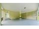Covered patio featuring white brick walls, concrete floors and a white door at 1448 Drayton Woods Dr, Tucker, GA 30084