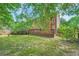 A charming backyard featuring mature trees and a spacious deck at 1259 Crescentwood Ln, Decatur, GA 30032