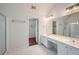 Bathroom features tiled floor, dual sinks, shower with glass door and vanity area at 1259 Crescentwood Ln, Decatur, GA 30032