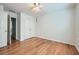 This bedroom offers wood floors, double-door closet, and a ceiling fan at 1259 Crescentwood Ln, Decatur, GA 30032