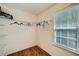 Walk-in closet shows wood floor, closet organizer and a window for natural lighting at 1259 Crescentwood Ln, Decatur, GA 30032