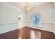 Elegant dining room with hardwood floors, wainscoting, and a stylish chandelier at 1259 Crescentwood Ln, Decatur, GA 30032