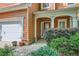 Charming home with a white garage door, front porch, and well-maintained landscaping at 1259 Crescentwood Ln, Decatur, GA 30032
