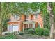 Charming two-story home with manicured landscaping, a welcoming front porch and a two car garage at 1259 Crescentwood Ln, Decatur, GA 30032