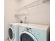 Laundry room with modern, front-load washer and dryer at 1259 Crescentwood Ln, Decatur, GA 30032