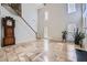 Spacious living room with soaring ceilings, large windows, and staircase to upper level at 1259 Crescentwood Ln, Decatur, GA 30032
