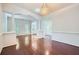 Spacious living space with hardwood floors, white columns, and great natural light at 1259 Crescentwood Ln, Decatur, GA 30032