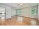 Spacious main bedroom features wood floors, ceiling fan, large windows and an ensuite bathroom at 1259 Crescentwood Ln, Decatur, GA 30032