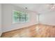 Spacious main bedroom features wood floors, ceiling fan, tray ceiling and natural lighting at 1259 Crescentwood Ln, Decatur, GA 30032