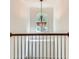 Staircase with decorative chandelier and an arched window at 1259 Crescentwood Ln, Decatur, GA 30032